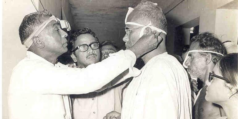 Dr. V examining a patient in early 1980s