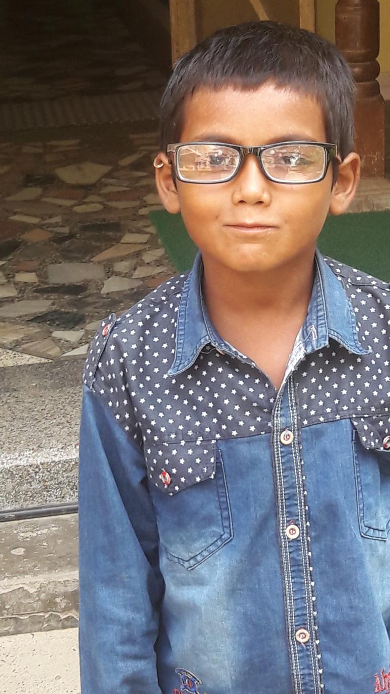 Guddu wearing his new glasses