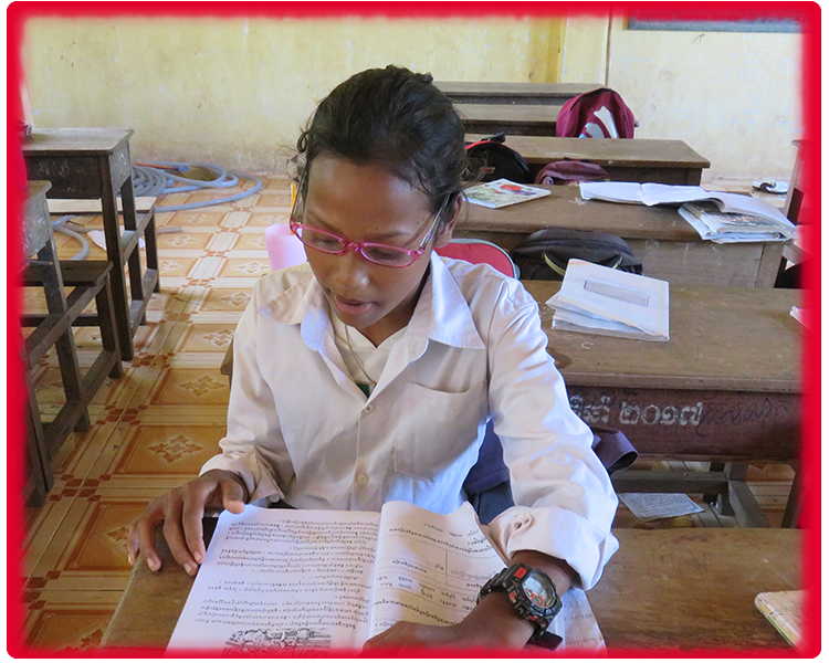 Thuon Cambodian girl with glasses studying
