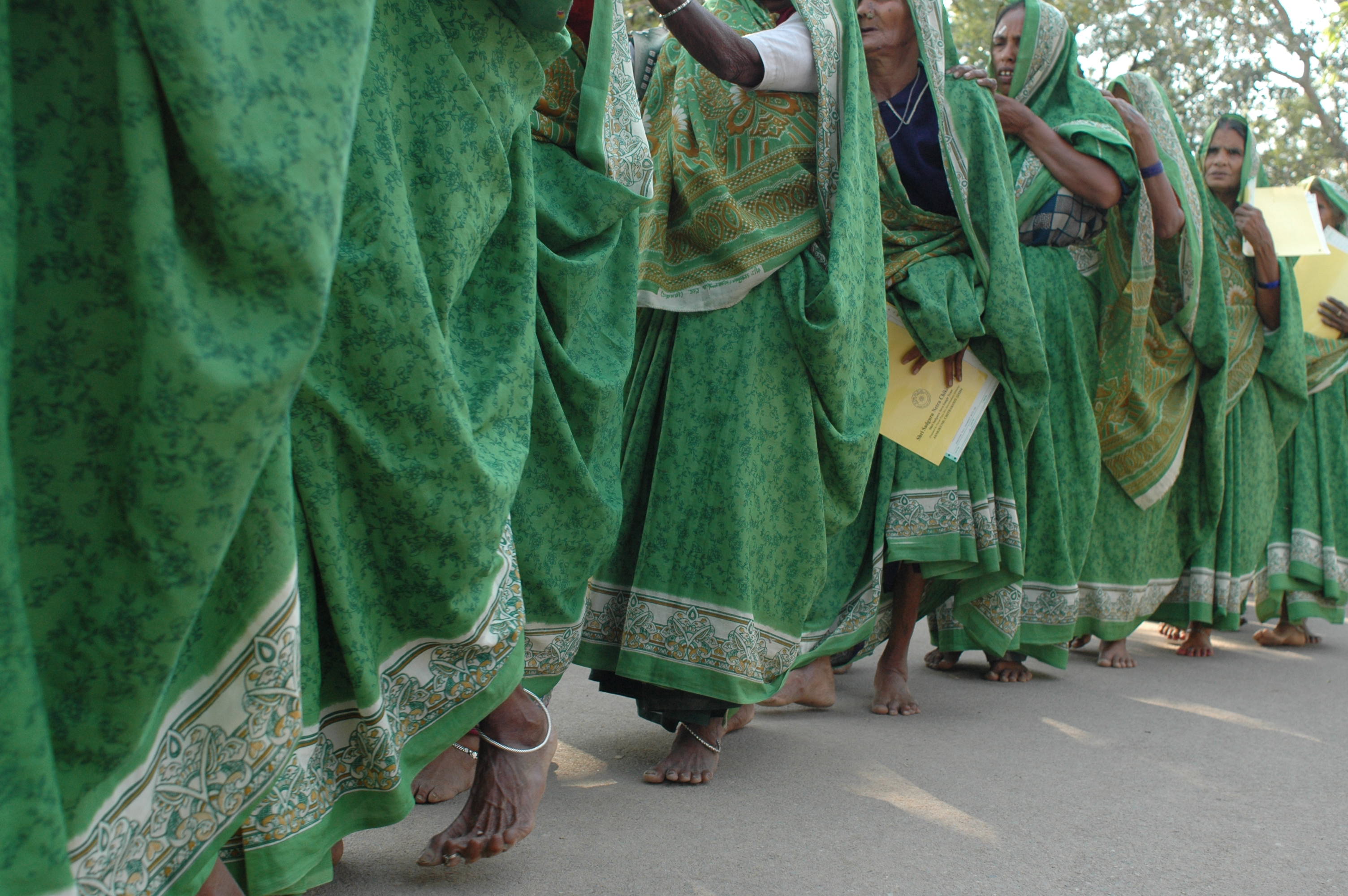 Line of blind women patients going for cataract surgery in India