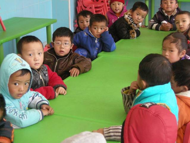 Tsultrim Dorje wearing his special aphakic glasses at school in Tibet