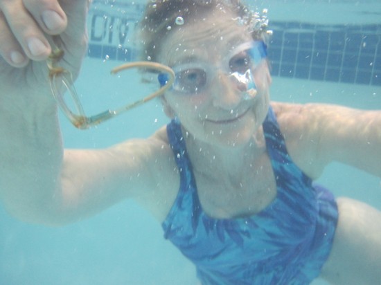 Susan dives for a pair of children's glasses