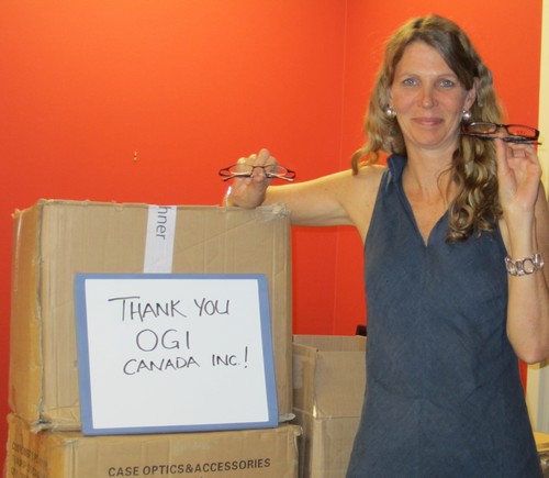 Heather from Seva with boxes of glasses from OGI