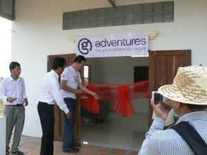 G Adventures representative cutting the ribbon at inauguration of the G Adventures 20/20 Vision Centre in Cambodia
