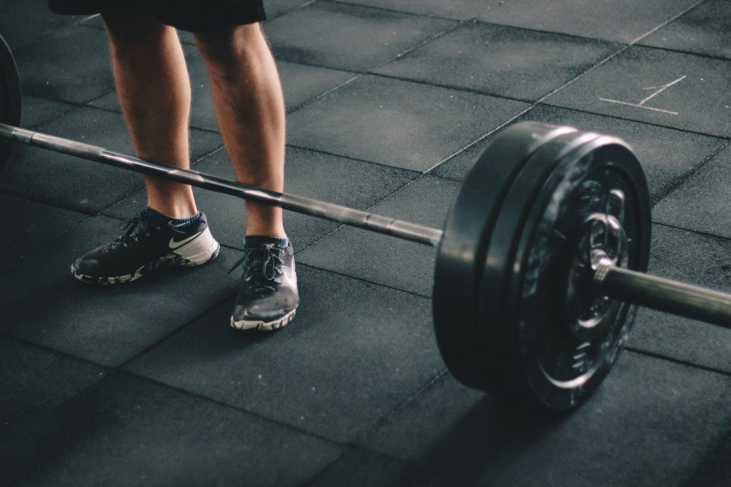 person stand beside a weight